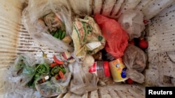 Food is stored in a broken refrigerator belonging to 18-member Ruzaiq family who live next to a garbage dump where they collect recyclables and food near the Red Sea port city of Hodeidah, Yemen, Jan. 16, 2018. 