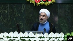 Iran's new President Hassan Rouhani delivers a speech after his swearing-in at the parliament in Tehran, Aug. 4, 2013.
