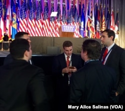 Campaign staff for Republican presidential candidate Donald Trump watch their smartphones as poll numbers begin to roll in, in New York, Nov. 8, 2016.