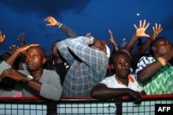 FILE - Nigerian supporters react as they watch the Russia 2018 World Cup football match between Nigeria and Argentina, in Lagos, June 26, 2018.