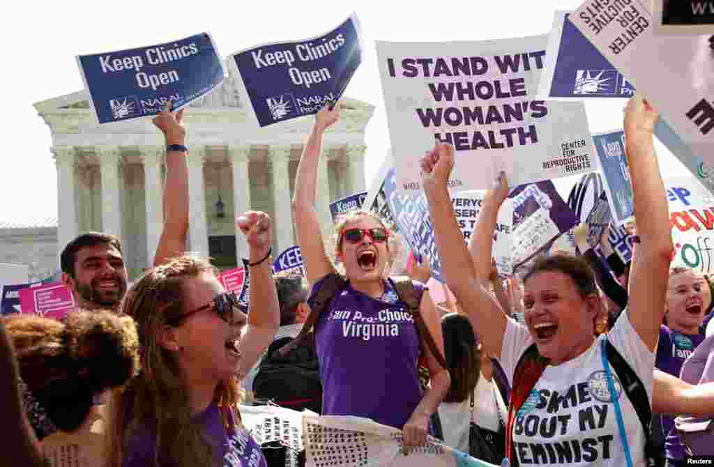 Demonstrators celebrate outside the U.S. Supreme Court after the court struck down a Texas law imposing strict regulations on abortion doctors and facilities that its critics contended were specifically designed to shut down clinics, in Washington.