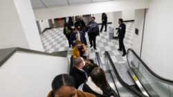 U.S. Capitol Police evacuate journalists and House press staff members from the Capitol to a connected office building, in Washington, U.S., January 6, 2021.