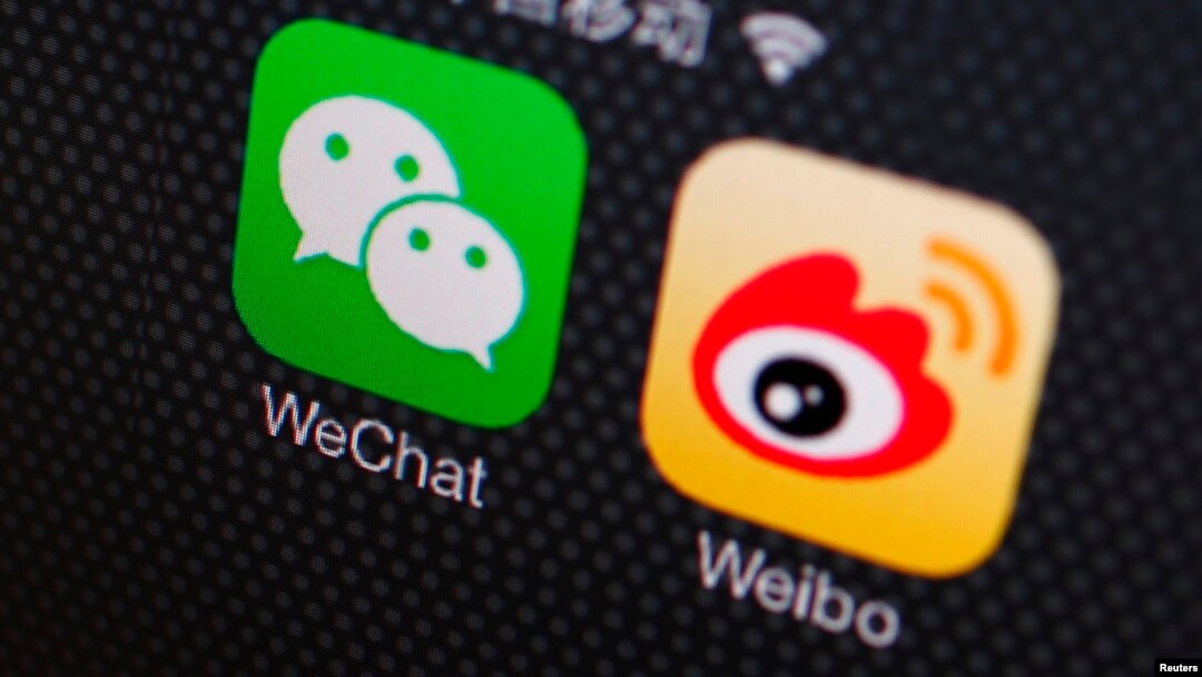 FILE - A picture illustration shows icons of WeChat and Weibo apps in Beijing, Dec. 5, 2013.
