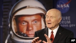Sen. John Glenn talks, via satellite, with the astronauts on the International Space Station, before the start of a roundtable discussion titled "Learning from the Past to Innovate for the Future" Monday, Feb. 20, 2012, in Columbus, Ohio. Glenn was the fi