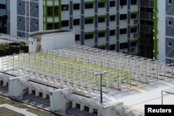 An aerial view shows Citiponics' urban farm located on the rooftop of a multi-story garage in a public housing estate in western Singapore, April 17, 2018.