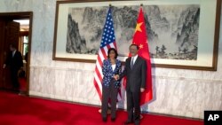 美国国家安全事务顾问赖斯在北京访问期间会见中国国务委员杨洁篪(资料照片)