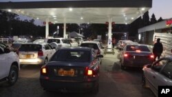 FILE: Motorists wait to fill up their tanks at a fuel station in Harare, Tuesday, Oct, 9, 2018. (AP)