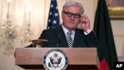 German Foreign Minister Frank-Walter Steinmeier speaks while meeting with Secretary of State John Kerry at the State Department in Washington, March 11, 2015.