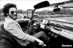 Bruce Springsteen is shown driving his 1957 Chevrolet Bel Air Convertible in this undated photo, referenced in his iconic song "Born to Run" which is up for auction and is expected to fetch several hundred thousand dollars, provided Dec. 15, 2016. (Courte