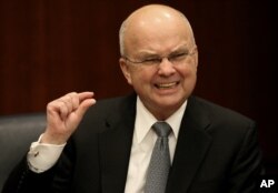 CIA Director Michael Hayden gestures during a news conference at CIA headquarters in Langley, Va., Jan. 15, 2009.