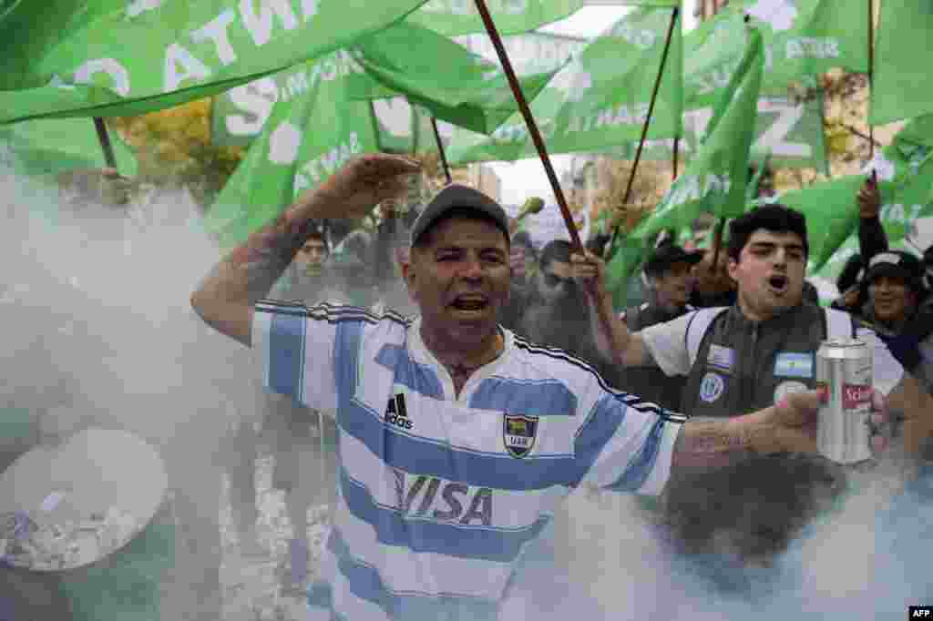 Workers demonstrate in Buenos Aires against government cuts in public expenditure and jobs. Argentina&#39;s President Mauricio Macri faces mass street protests after major labor unions vow to demonstrate against job cuts imposed under his economic reforms.