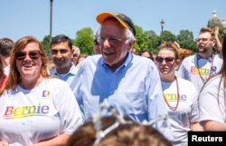 Democratic 2020 U.S. presidential candidate Senator Bernie Sanders walks with supporters as he campaigns at the Capital Pride LGBTQ gay pride celebration at the Iowa State Capitol in Des Moines, Iowa, June 8, 2019.