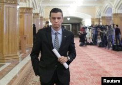 Romania's Prime Minister Sorin Grindeanu leaves a meeting at the parliament in Bucharest, Feb. 6, 2017.