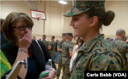 Maria Daume watches her mother, Maureen Daume, become emotional after Maria's graduation from the Marine Corps School of Infantry, March 23, 2017, in Camp Lejeune, N.C. (C. Babb/VOA)