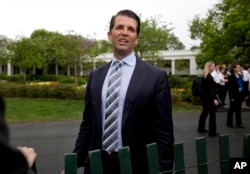 FILE - Donald Trump Jr., the son of President Donald Trump, speaks to media on the South Lawn of the White House in Washington, April, 17, 2017. Some of the attention of ongoing probes is expected to be focused squarely on him.