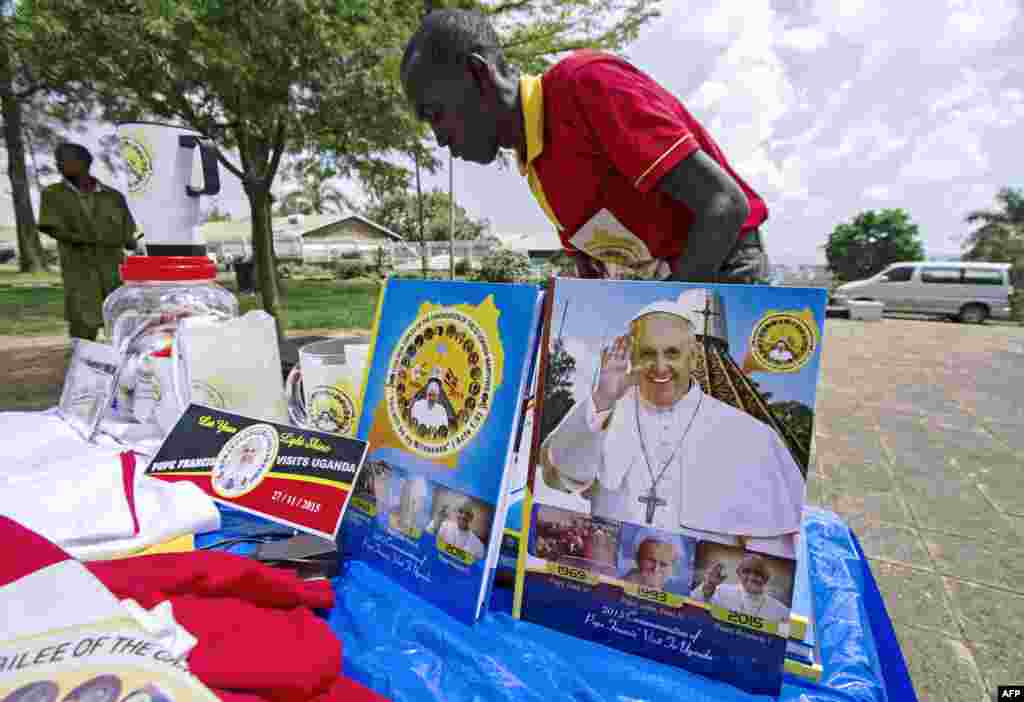 A vendor arranges portraits of Pope Francis outside of the Lubaga Cathedral in Kampala, Uganda. The pontiff will be in Kenya from Nov. 25-27, spend the next two days in Uganda, and then travel on to the Central African Republic where his trip will end Nov. 30.