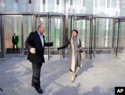 Charles Townsend, CEO of Conde Nast, arrives at One World Trade Center with Patricia Röckenwagner, senior vice president of Corporate Branding and Communications, Nov. 3, 2014, in New York.