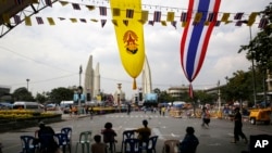 Anti-government protesters wait for the next course of action from their leaders, near the Democracy Monument, in Bangkok, Thailand, Friday, Dec. 6, 2013. The truce between Thailand’s political rivals held in Bangkok on Friday amid more ceremonies in hono