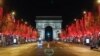 Jalan Champs Elysees menuju Arc de Triomphe di Paris tampak lengang saat penerapan jam malam untuk meredam penyebaran virus corona (Covid-19) di Paris, 15 Desember 2020. (Foto: Reuters)