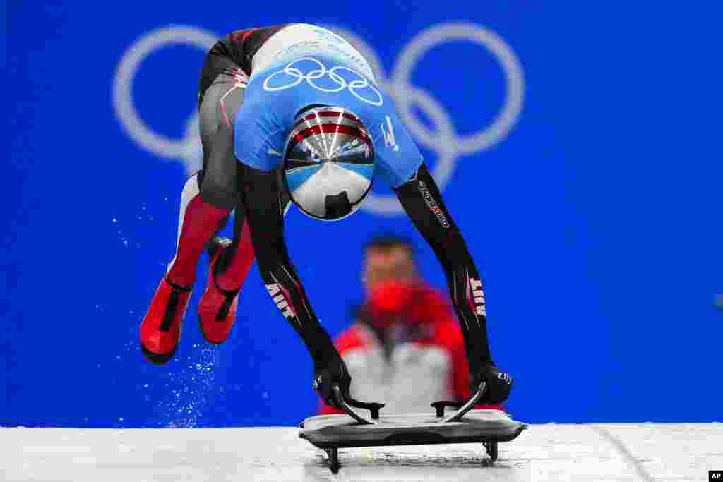 Janine Flock of Austria slides during the women&#39;s skeleton run 2 at the 2022 Winter Olympics, in the Yanqing district of Beijing.