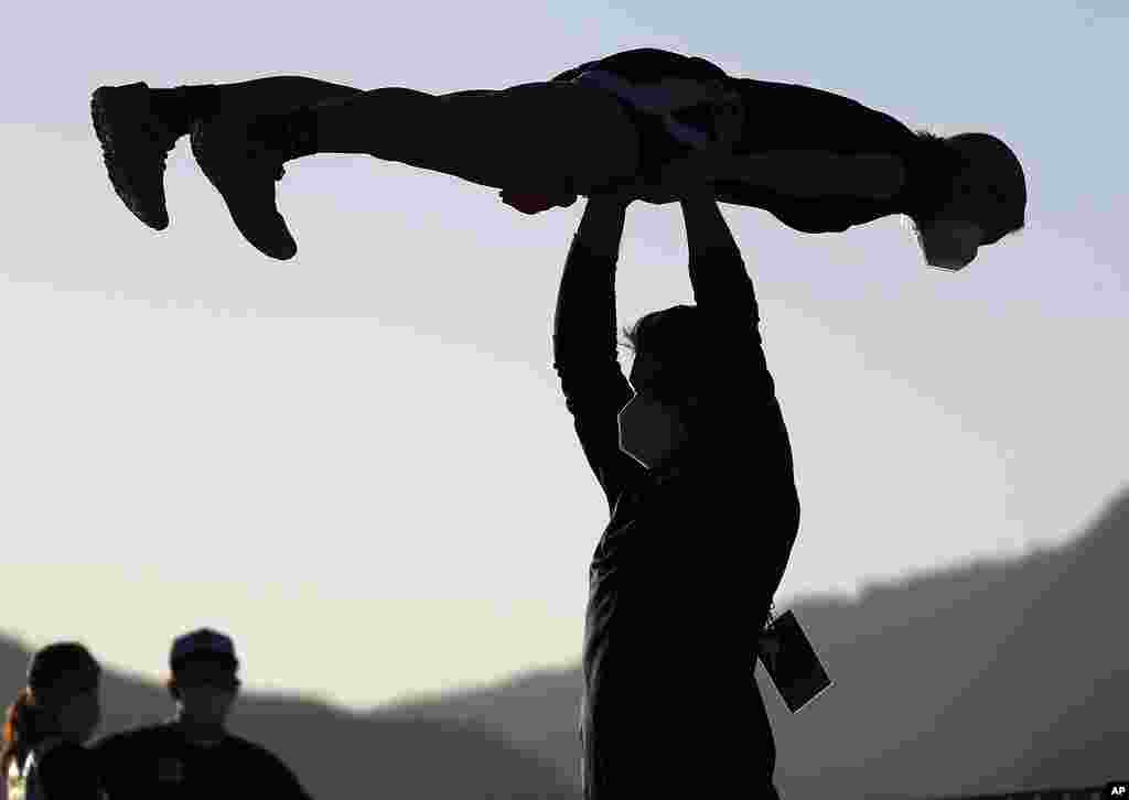 Athletes practice for the ski jumping event at the FIS Nordic World Ski Championships in Oberstdorf, Germany.