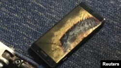 The burned Samsung Note 7 smartphone belonging to Brian Green is pictured in this undated handout photo obtained by Reuters, Oct. 6, 2016. The replacement model of the fire-prone smartphone began smoking inside a Southwest Airlines plane on Oct. 5, 2016. 