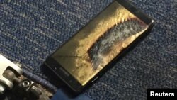 The burned Samsung Note 7 smartphone belonging to Brian Green is pictured in this undated handout photo obtained by Reuters, Oct. 6, 2016. 