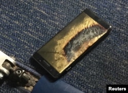 The burned Samsung Note 7 smartphone belonging to Brian Green is pictured in this undated handout photo obtained by Reuters, Oct. 6, 2016.