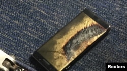 The burned Samsung Note 7 smartphone belonging to Brian Green is pictured in this undated handout photo obtained by Reuters, Oct. 6, 2016.