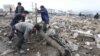 Workers recover cement blocks from flood-damaged areas in Onsong, North Korea, Sept. 16, 2016. 