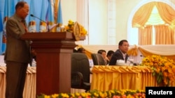 Cambodian People's Party Honorary President and President of the National Assembly of Cambodia Heng Samrin (L) speaks as Vice President of the CPP and Cambodia's Prime Minister Hun Sen looks on at the Extraordinary General Assembly of Cambodian People's Party, in central Phnom Penh January 30, 2015.