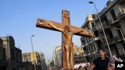 Angry Egyptian Christians protest outside St. Mark's Cathedral against the military ruling council, Oct. 10, 2011, a day after at least 24 people were killed in central Cairo