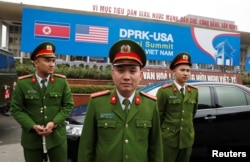 Vietnamese police officers stand guard outside the North Korea-U.S. summit's media center in Hanoi, Vietnam, Feb. 23, 2019.