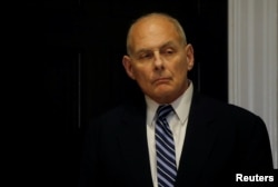 FILE - White House Chief of Staff John Kelly listens as President Donald Trump holds a round table meeting in the Roosevelt Room at the White House in Washington, March 20, 2018.