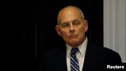 White House Chief of Staff John Kelly listens as President Donald Trump holds a round table meeting with members of law enforcement about sanctuary cities in the Roosevelt Room at the White House in Washington, March 20, 2018.