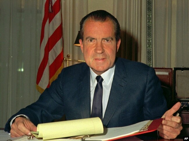FILE - President Richard M. Nixon, is shown at his desk in the White House, Feb. 16, 1969.