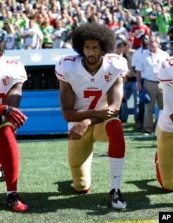 FILE - San Francisco 49ers' Colin Kaepernick kneels during the national anthem before an NFL football game against the Seattle Seahawks, in Seattle, Washington, Sept. 25, 2016.