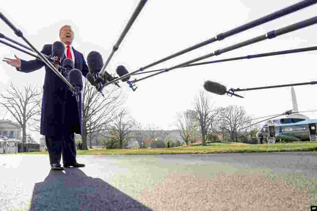 President Donald Trump speaks to reporters before boarding Marine One on the South Lawn of the White House in Washington to travel to Andrews Air Force Base, Maryland, and then on to California.