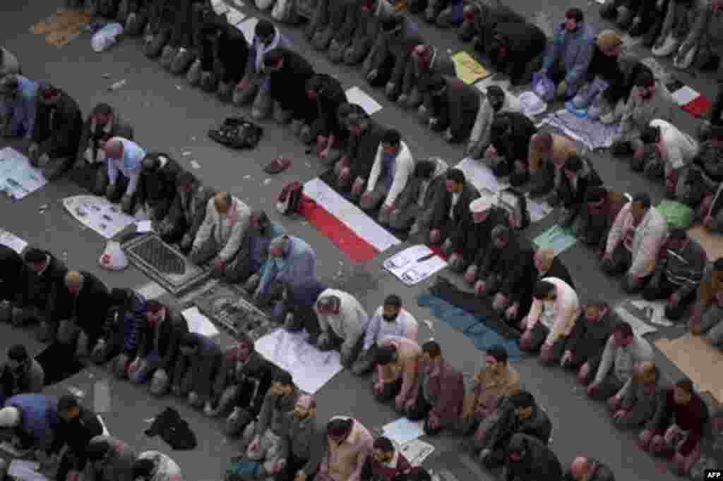 Anti-government protesters pray in Tahrir, or Liberation Square in Cairo, Egypt, Tuesday, Feb. 1, 2011. More than a quarter-million people flooded into the heart of Cairo Tuesday, filling the city's main square in by far the largest demonstration in a wee