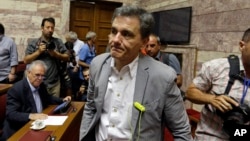 Greek Finance Minister Euclid Tsakalotos arrives for a meeting with lawmakers of Syriza party at the Greek Parliament in Athens, July 10, 2015.