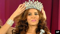 FILE - Maria Jose Alvarado is crowned the new Miss Honduras in San Pedro, Sula, Honduras, April 26, 2014. 