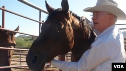 Rancher Jim Chilton with his horse Arnold near Arivaca, Arizona, July 12, 2016. (G. Flakus/VOA)