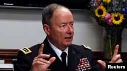 General Keith Alexander, director of the National Security Agency (NSA) and U.S. Cyber Command speaks to reporters during the Reuters Cybersecurity Summit in Washington, May 14, 2013. 