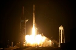 A SpaceX Falcon 9 rocket with the Crew Dragon capsule lifts off from Launch Pad 39A at the Kennedy Space Center in Cape Canaveral, Fla., Nov. 10, 2021.