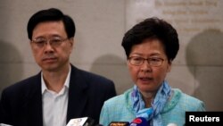 香港特首林正月娥和香港保安局局長李家超等官員在香港警察總部舉行記者會。(2019年7月2日)