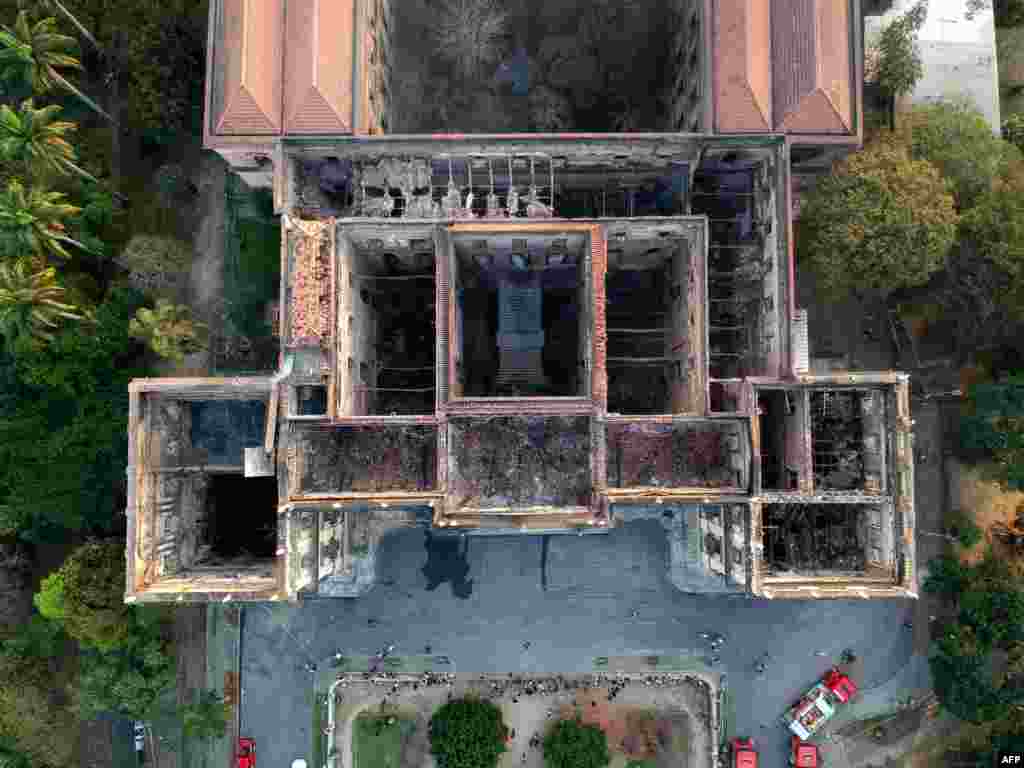 Drone view of Rio de Janeiro&#39;s treasured National Museum, one of Brazil&#39;s oldest, a day after a massive fire ripped through the building, Sept. 3, 2018. The majestic edifice stood engulfed in flames as plumes of smoke shot into the night sky, while firefighters battled to control the blaze that erupted around 2230 GMT. Five hours later they had managed to smother much of the inferno that had torn through hundreds of rooms, but were still working to extinguish it completely, according to an AFP photographer at the scene.