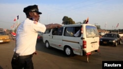 A policeman regulates traffic in Monrovia, Liberia, Jan. 29, 2013.