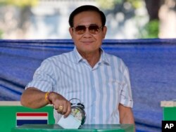 Thailand's Prime Minister Prayuth Chan-ocha casts his vote at a polling station in Bangkok, Thailand, March 24, 2019, during the nation's first general election since the military seized power in a 2014 coup.