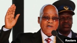 South African President Jacob Zuma takes his oath of office during his inauguration ceremony at the Union Buildings in Pretoria May 24, 2014.