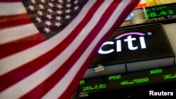 A Citigroup logo is pictured from the floor of the New York Stock Exchange, July 9, 2014. 